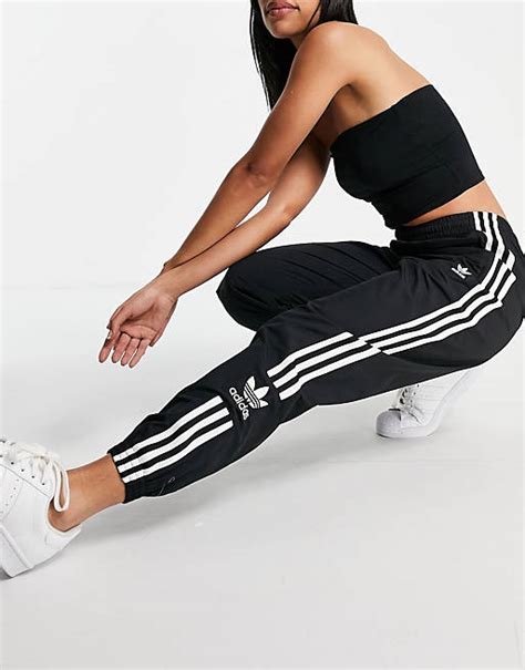 adidas Originals Lock Up three stripe track pants in .